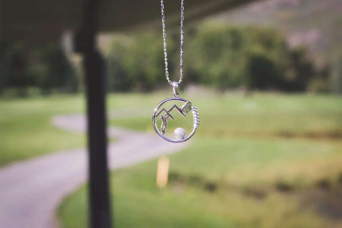 Golf Pendant by Park City Jewelers Hanging from a Golf Cart