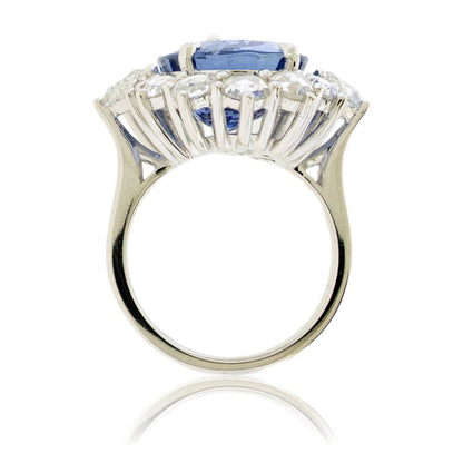 Large Oval Blue Sapphire with Round and Diamond Halo Style Ring