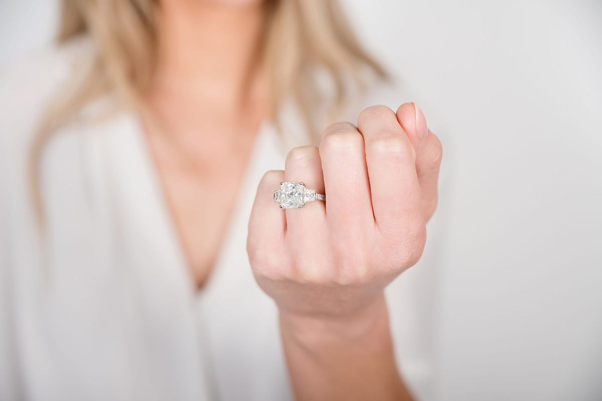 Woman Wearing Large Princess Cut Diamond Ring from Park City Jewelers