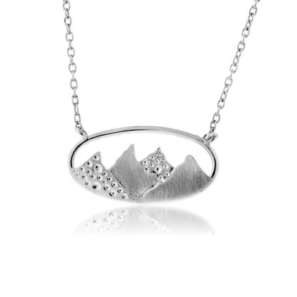 Silver necklace with a mountain pendant on a white background