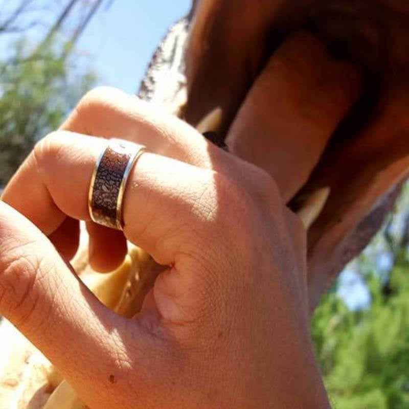 Man wearing dinosaur bone ring - Park City Jewelers. 