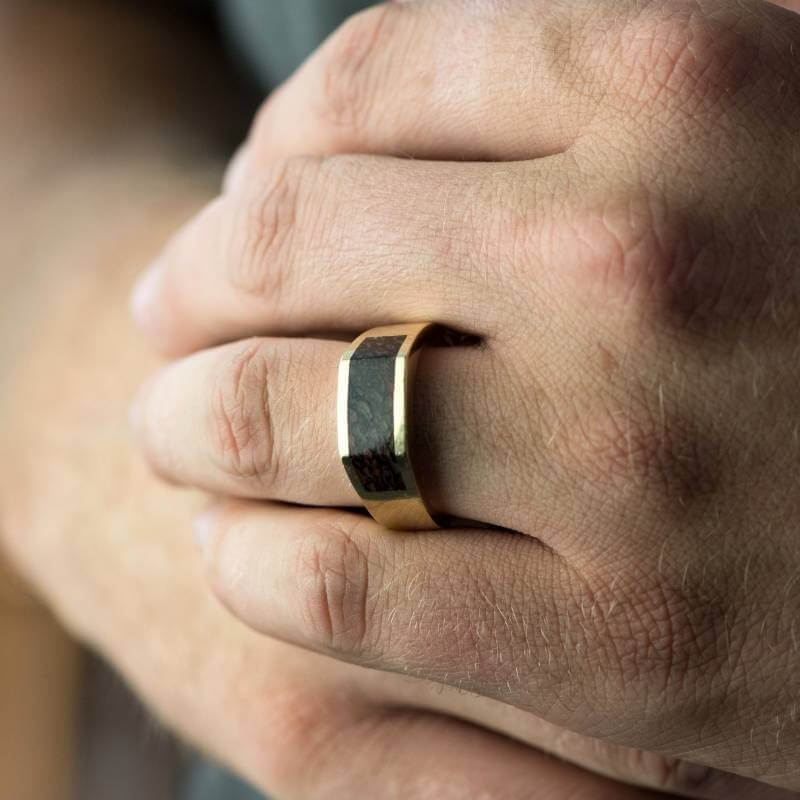 Man wearing dinosaur bone inlay ring