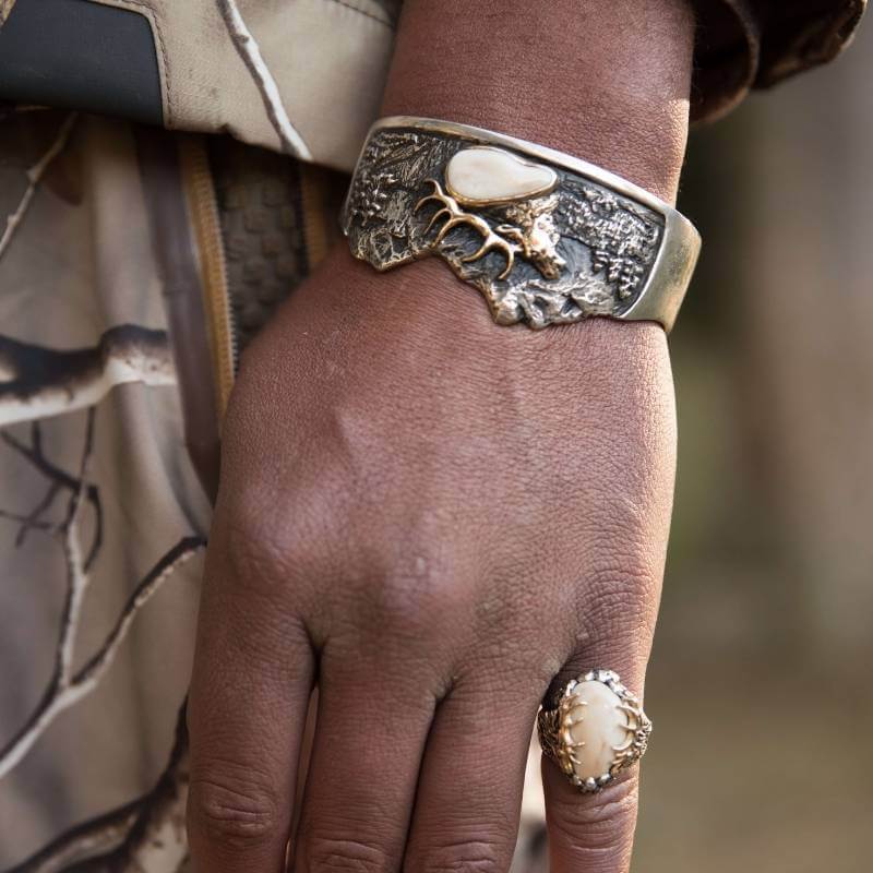 Man wearing elk ivory ring and bracelet by Park City Jewelers. 
