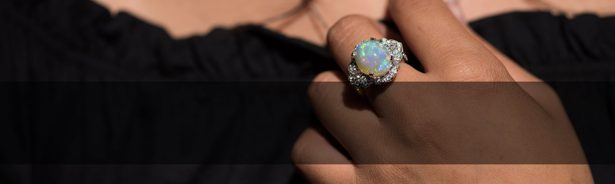 Woman Wearing Opal Ring by Park City Jewelers