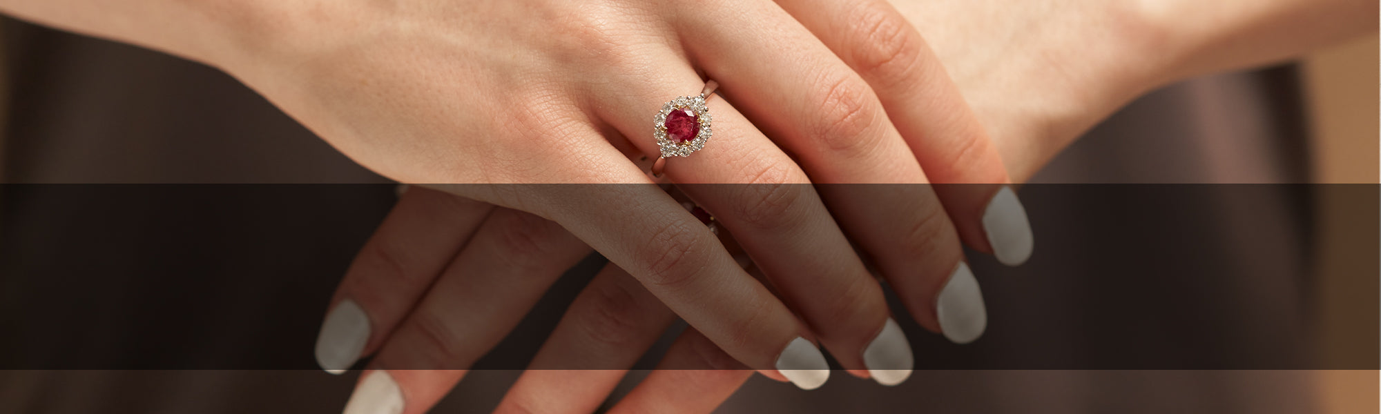 Woman Wearing Red Emerald Ring by Park City Jewelers