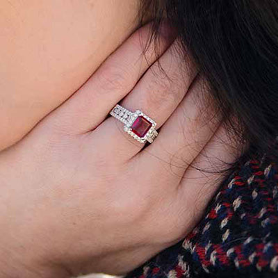 Woman Wearing Park City Jewelers Princess Cut Red Emerald Ring