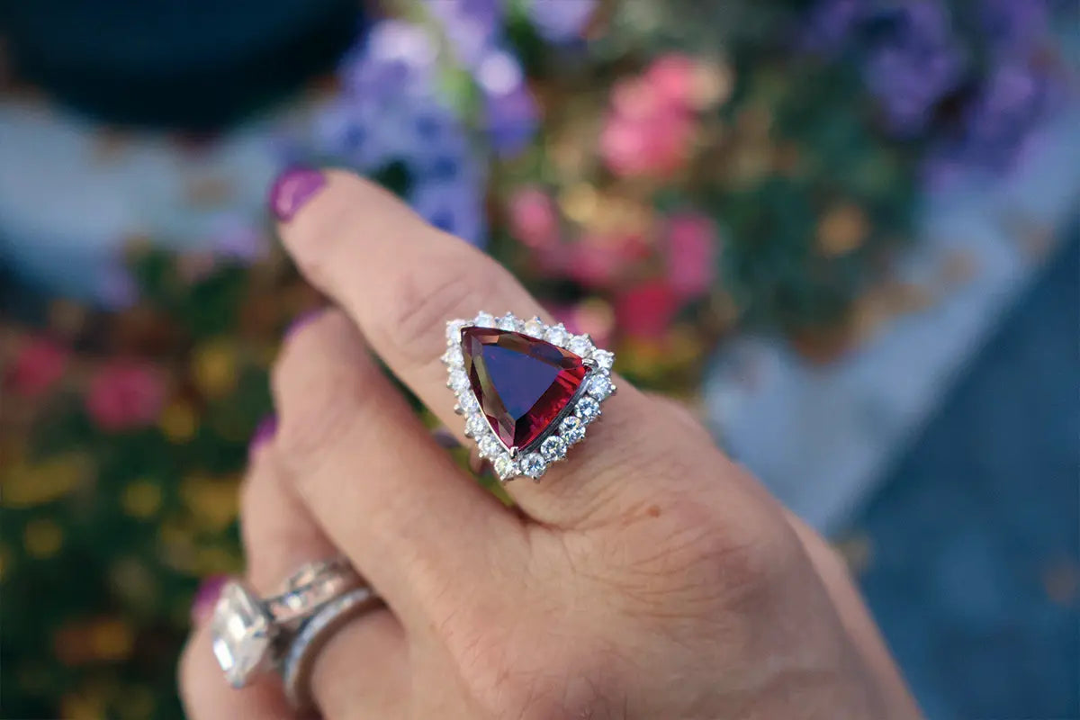 Woman Wearing Rubelite Diamond Halo Ring from Park City Jewelers