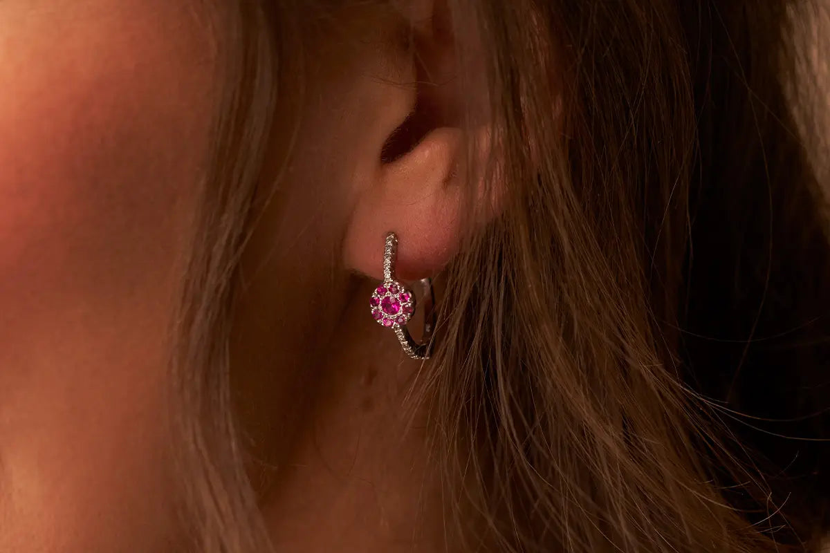 Woman Wearing Ruby Cluster Earrings from Park City Jewelers