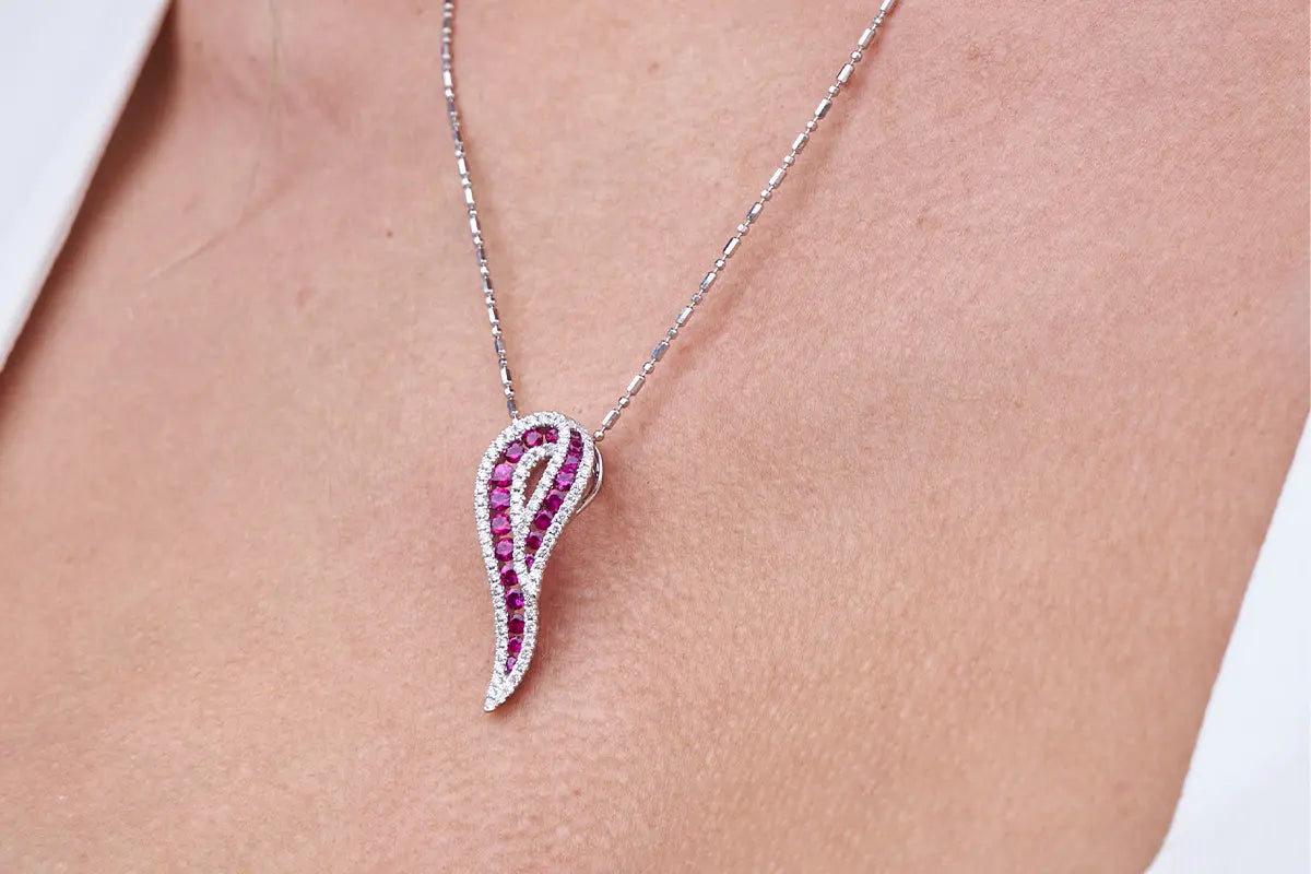 Woman Wearing Ruby and Diamond Pendant from Park City Jewelers