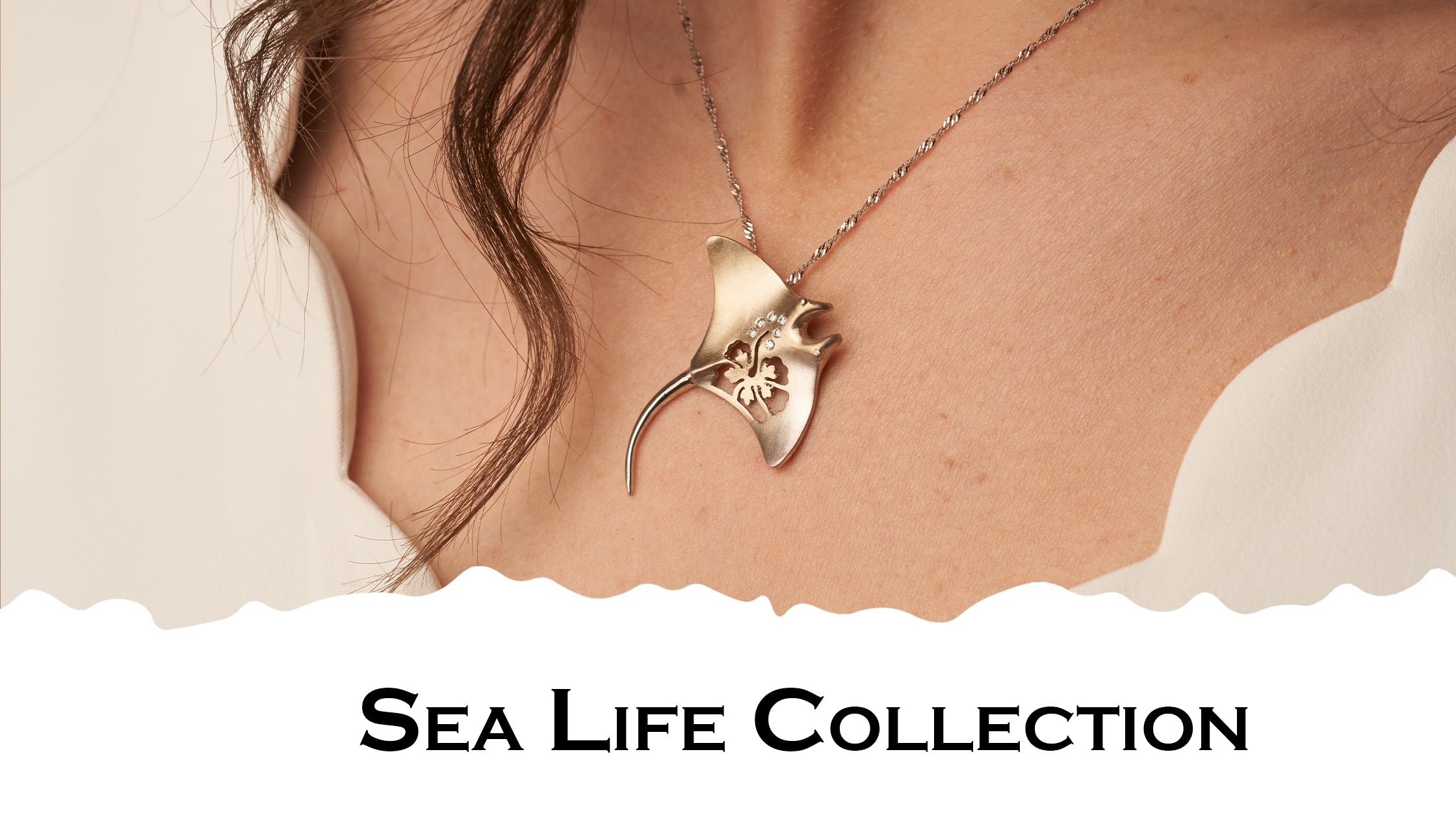 Sea Life Blog Banner with a Woman Wearing a Gold Manta Ray Pendant by Park City Jewelers. 