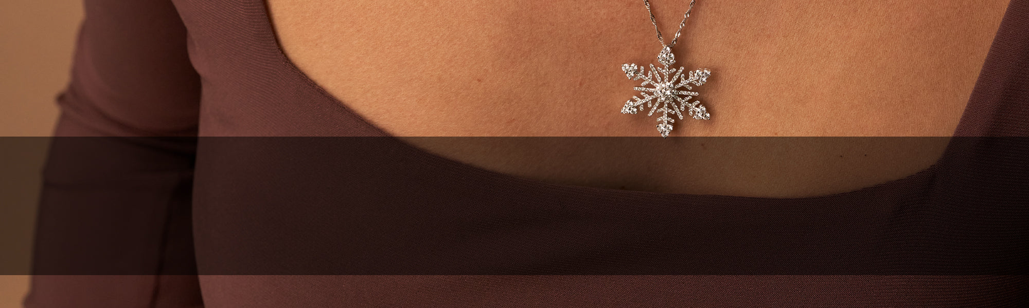 Woman Wearing Diamond Snowflake Pendant from Park City Jewelers