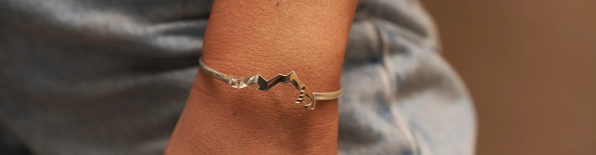 Woman Wearing Sterling Silver Mountain Bracelet from Park City Jewelers