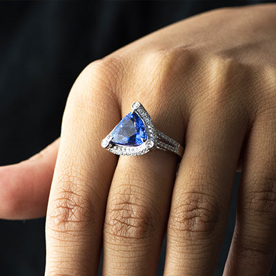 Woman wearing trillion cut tanzanite ring 
