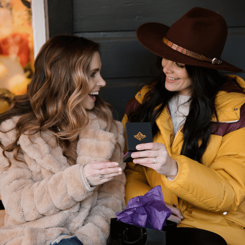 Two women holding park city jewelers box