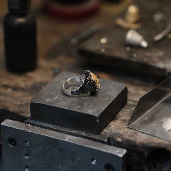 Finished Elk Ivory Ring on Jeweler's Bench - Park City Jewelers. 