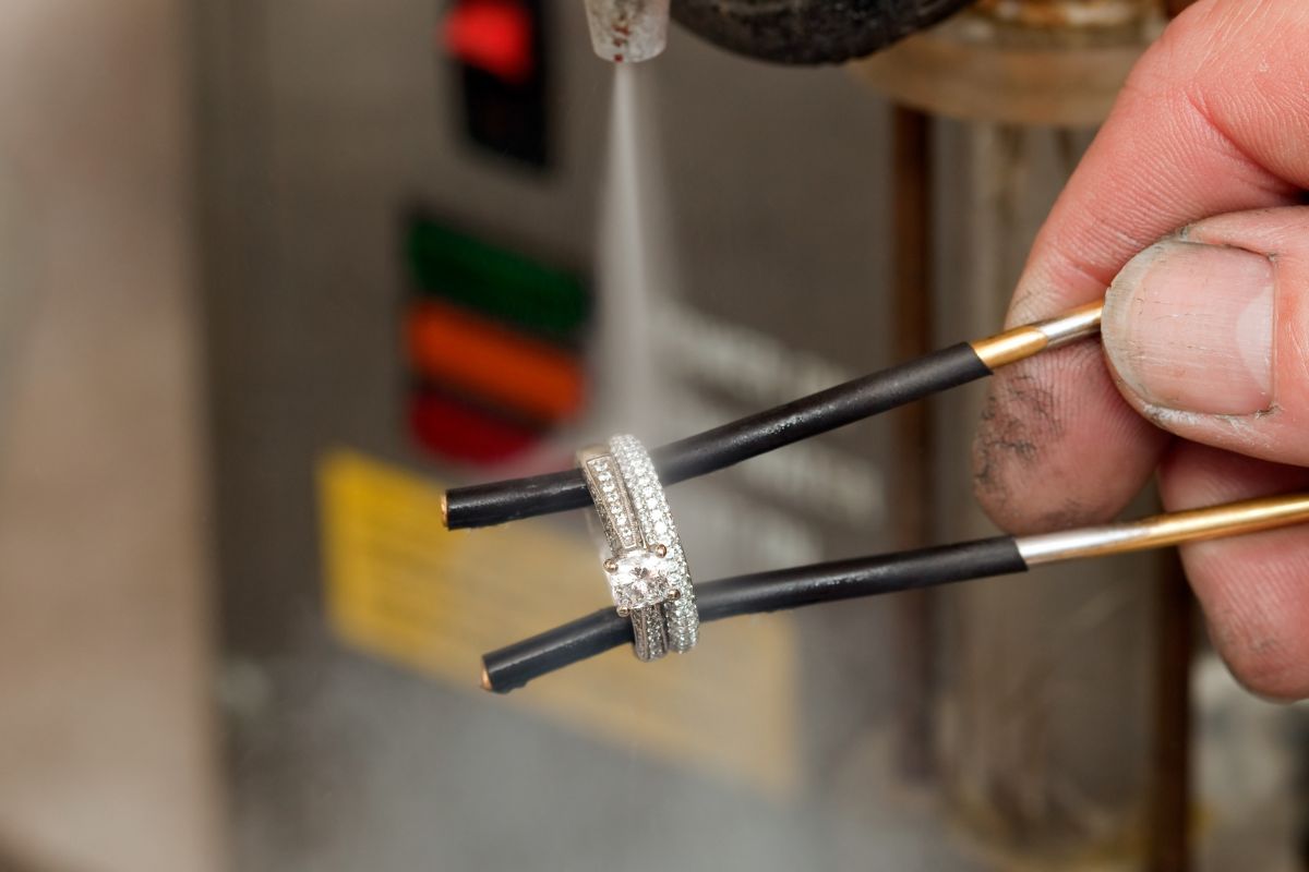 Man Cleaning Jewelry with a Steam Cleaner