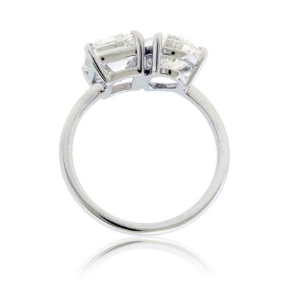 Side profile highlighting the elevated two-stone design and smooth 14K white gold shank.