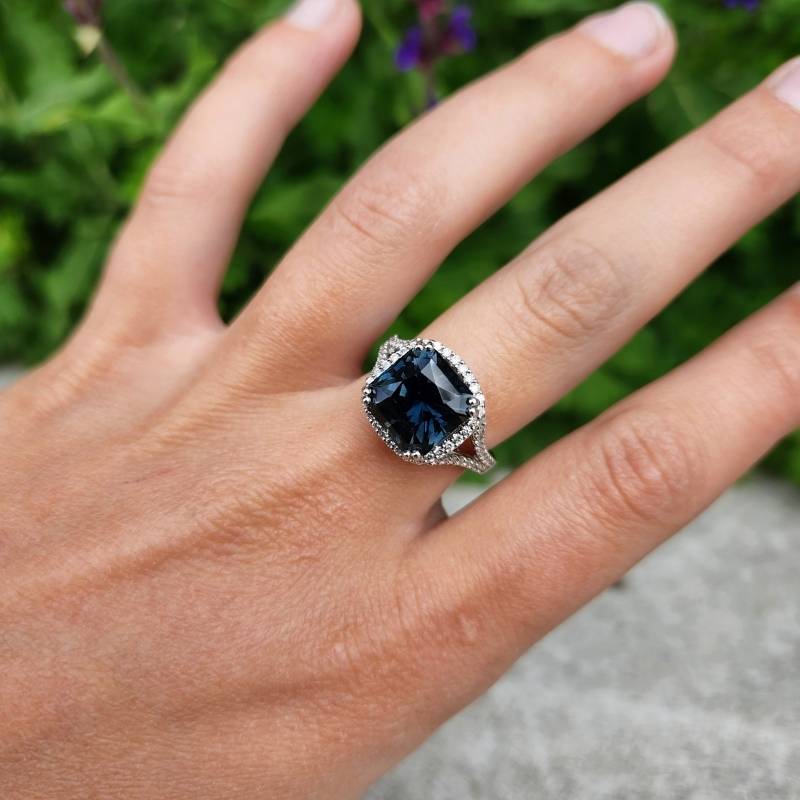 Woman wearing peacock sapphire ring