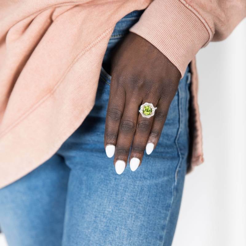 Woman wearing peridot ring