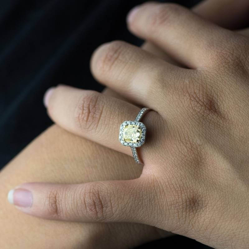 Woman wearing yellow diamond ring