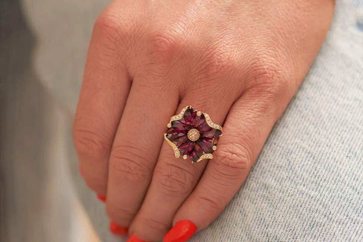 Woman Wearing Bellarri Garnet Flower Ring from Park City Jewelers