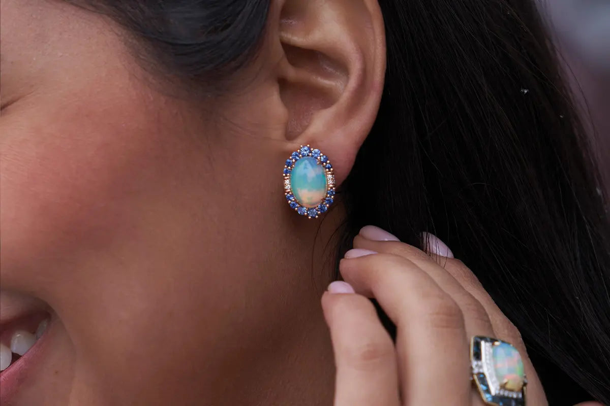 Woman Wearing Opal Earrings from Park City Jewelers. 