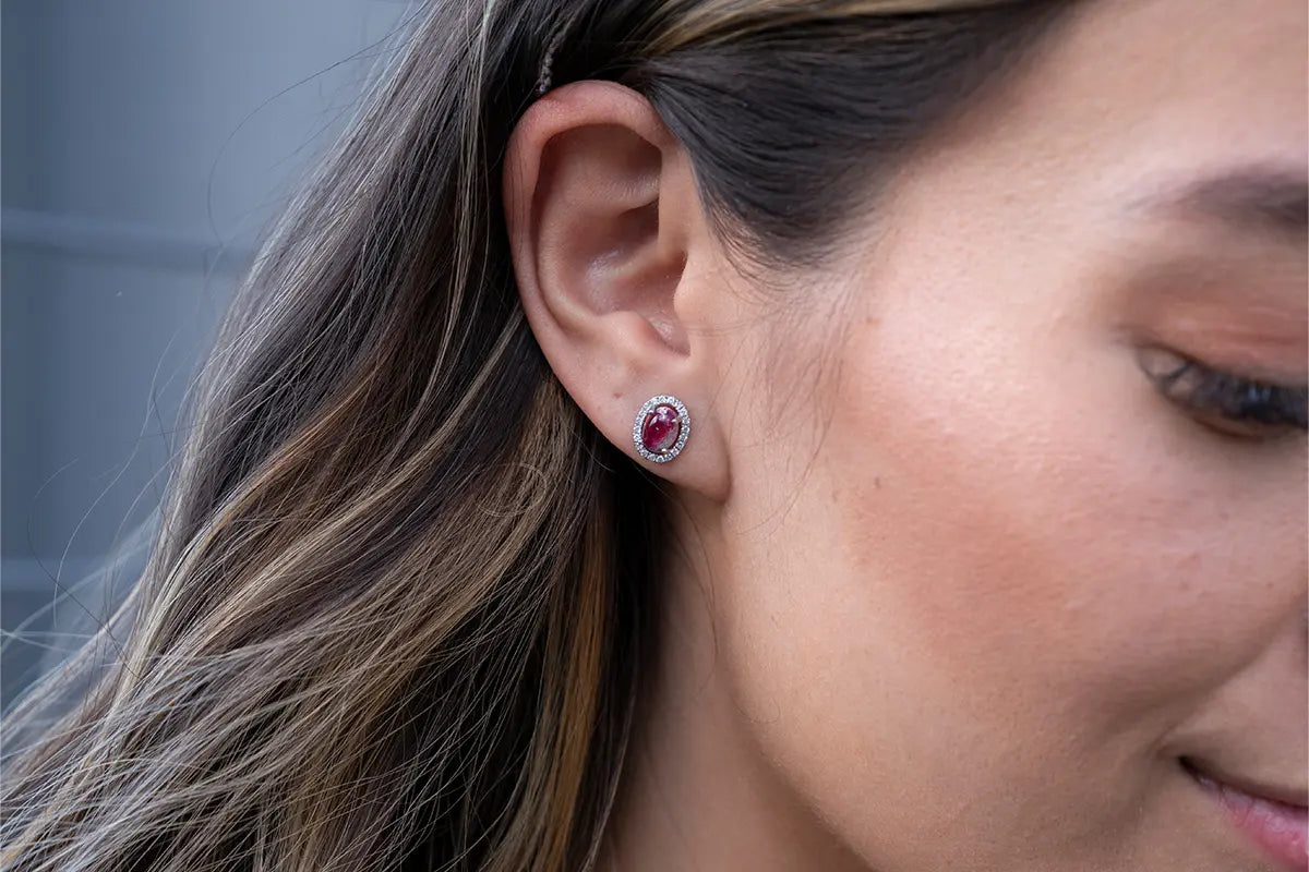 Woman Wearing Red Emerald Cabochon Earring from Park City Jewelers