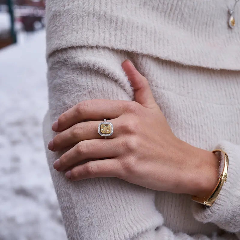 Woman Wearing a Yellow Diamond Ring from Park City Jewelers. 