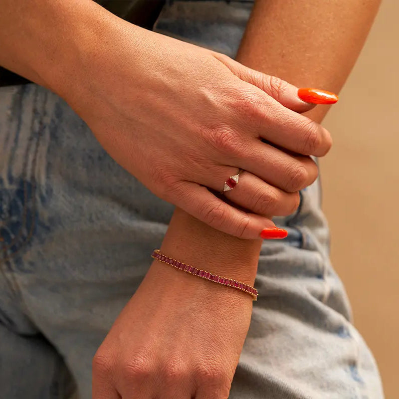 Woman Wearing Red Emerald Bracelet and Ring from Park City Jewelers