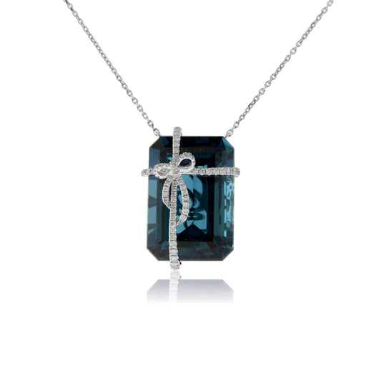 Blue Topaz & Diamond Bow Pendant with Chain - Park City Jewelers