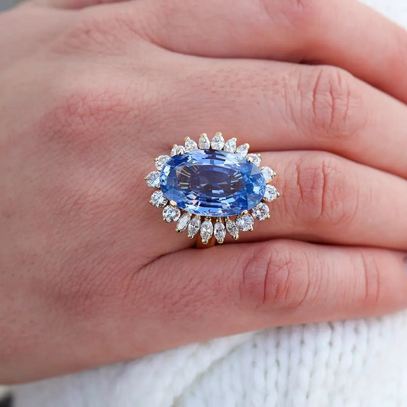 Large Oval Blue Sapphire with Round and Marquise Diamond Halo Style Ring - Park City Jewelers