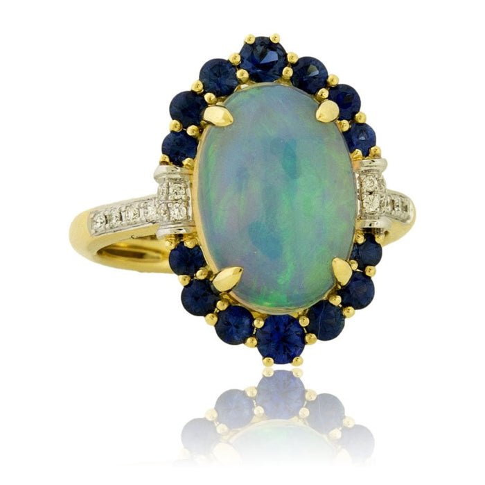 Oval Cabochon Opal Ring with Sapphire & Diamond Halo - Park City Jewelers