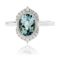 Oval - Cut Aquamarine with Unique Diamond Halo Ring - Park City Jewelers