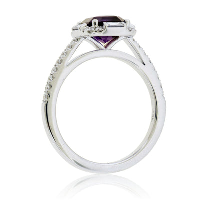 Side profile of the purple sapphire halo ring, showing the pavé diamond band and the cathedral-style white gold setting.