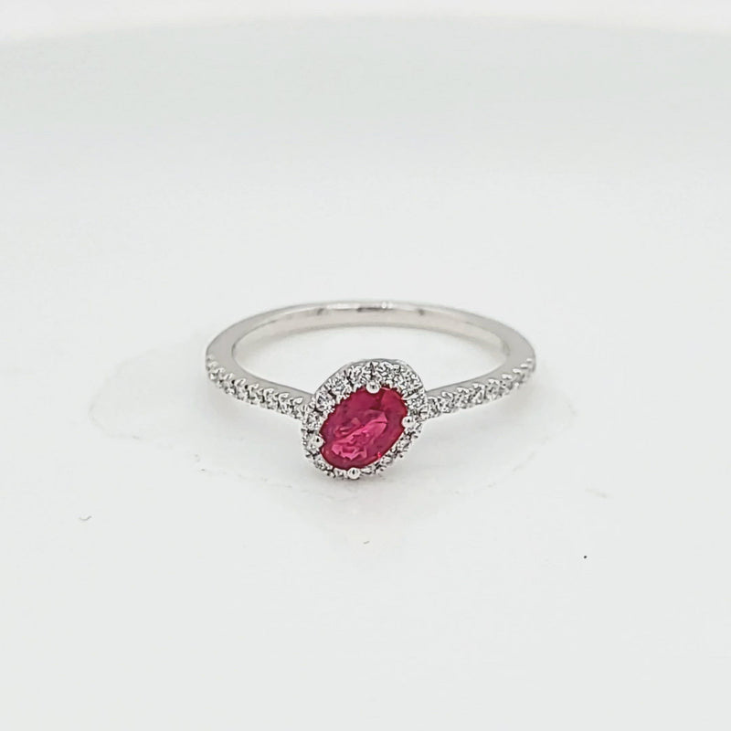 Tilted Oval Ruby and Diamond Halo Ring