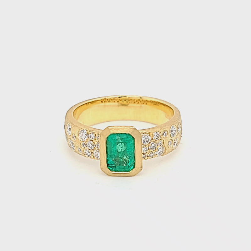 Bezel Set Emerald-Cut Emerald in Yellow Gold with Flush Set Diamond Band