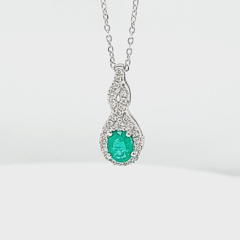 Oval Shaped Emerald Pendant with Diamond Halo