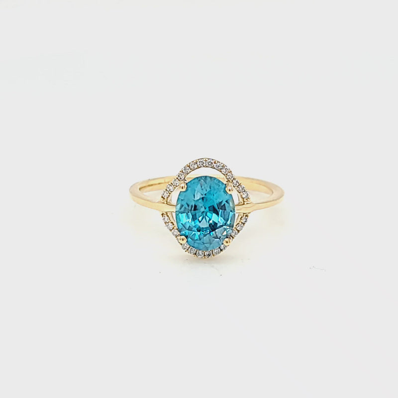 Oval Cut Blue Zircon & Diamond Halo Style Ring