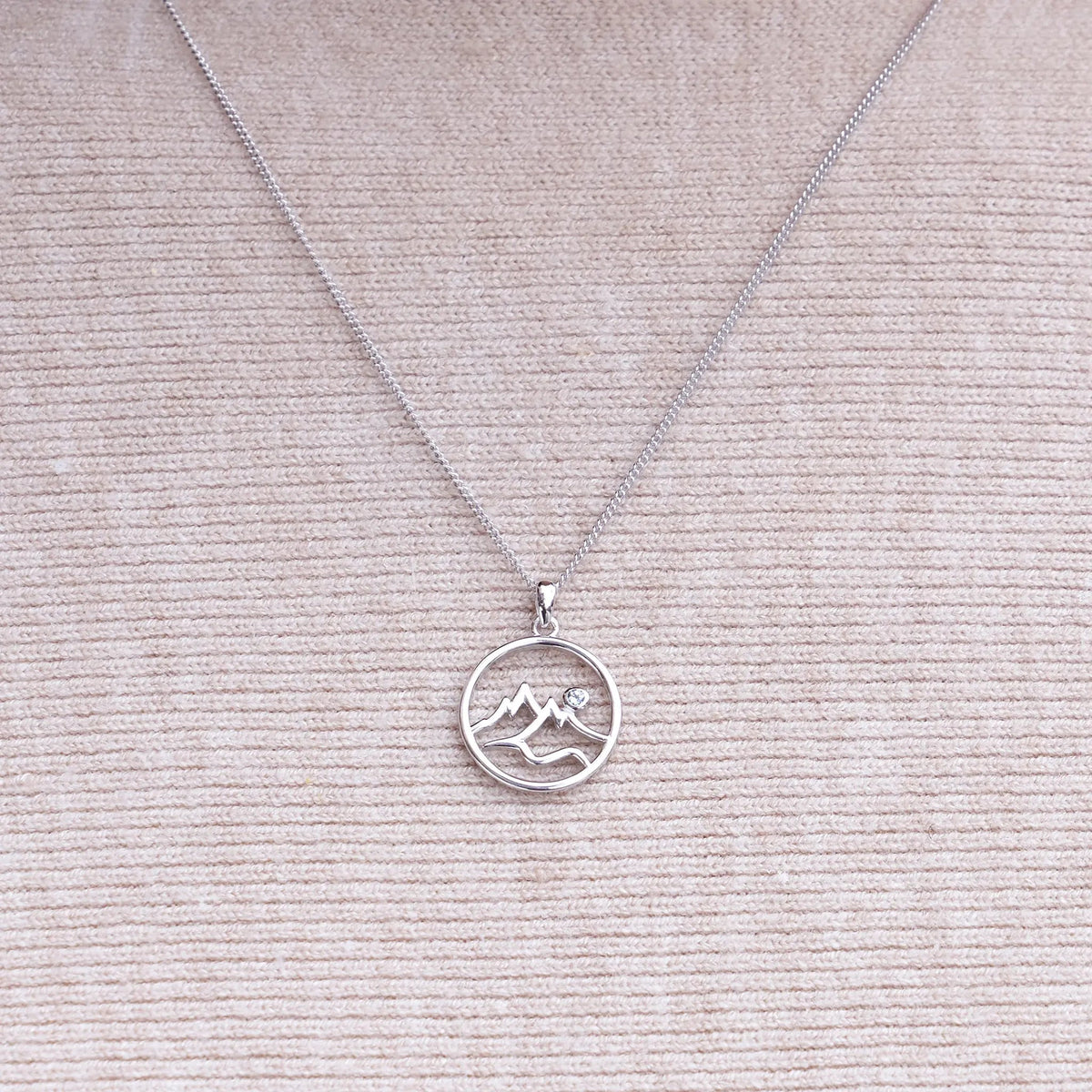 Circle Mountain Silhouette with Blue Topaz Accent Pendant - Park City Jewelers