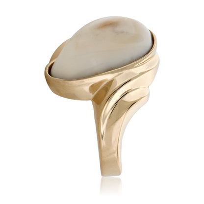 Side profile of the 14K yellow gold elk ivory wave ring, showing the fluid, sculptural design of the band.