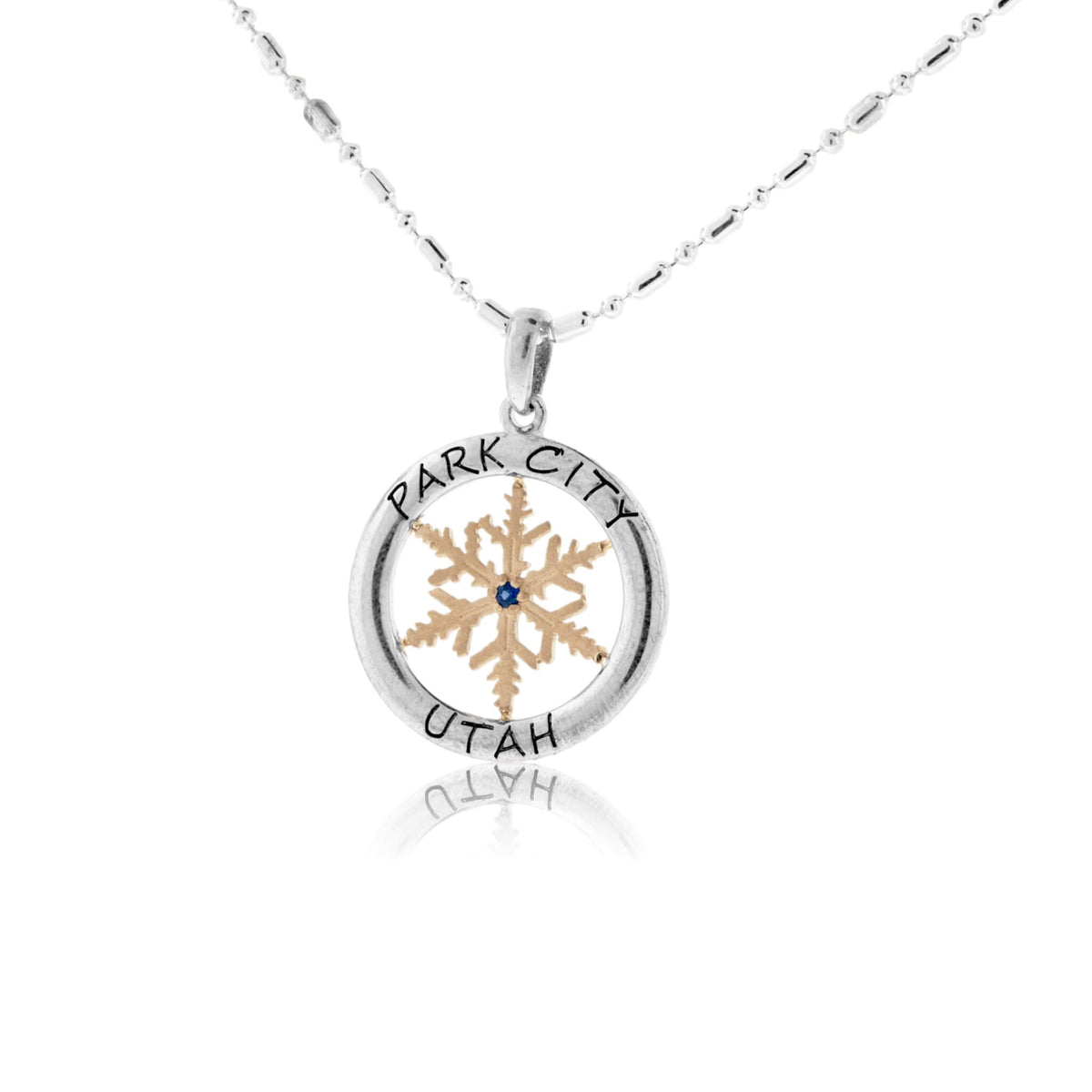 Gold Sapphire Center Snowflake in Sterling Silver Circle - Park City Jewelers
