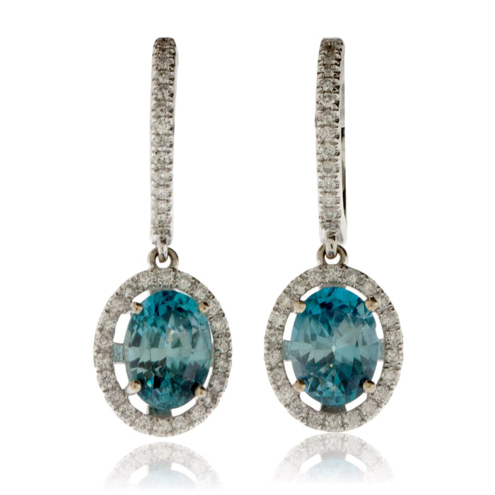 Oval Blue Zircon & Diamond Halo Dangle Earrings - Park City Jewelers