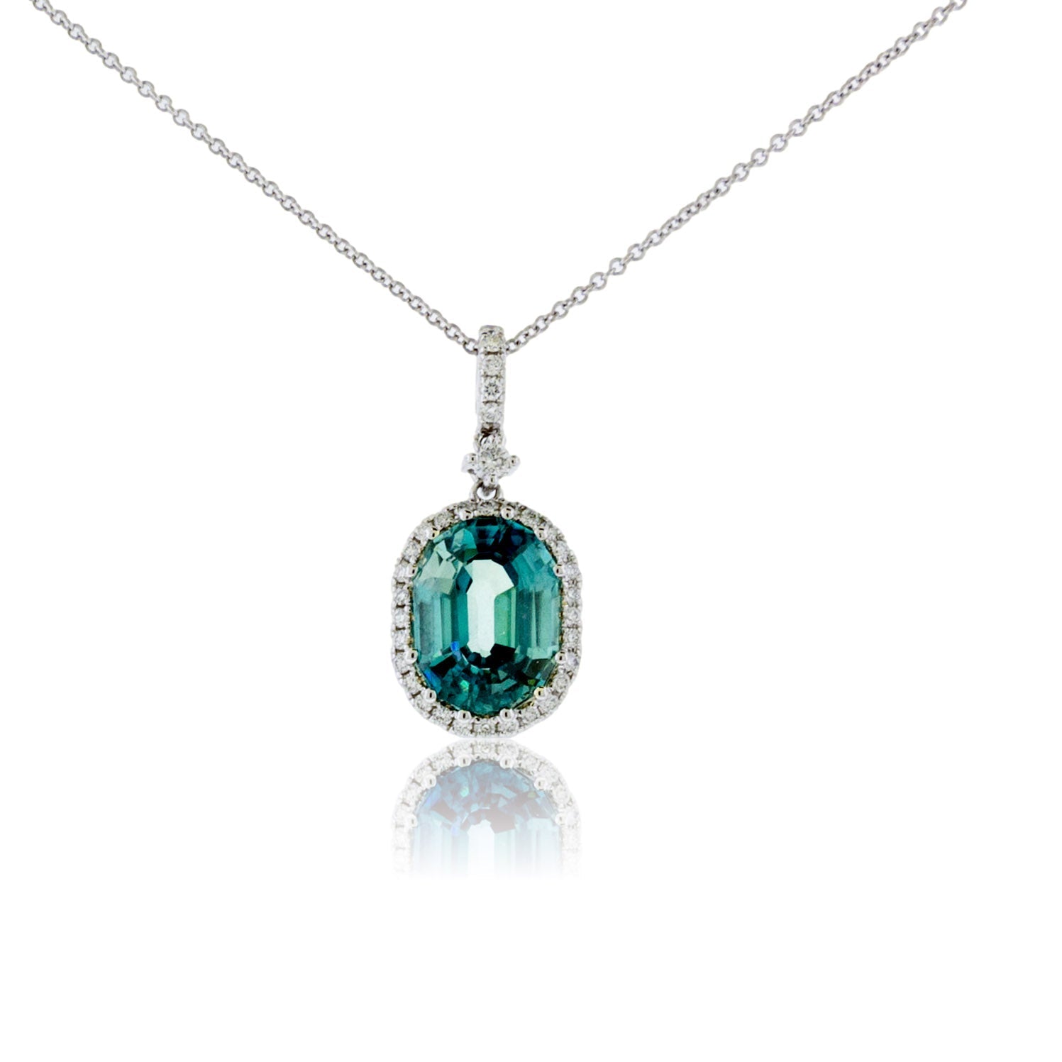 Oval Blue Zircon in Diamond Halo Pendant - Park City Jewelers