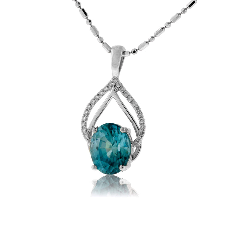 Oval Blue Zircon with Diamond & Gold Outline Pendant - Park City Jewelers