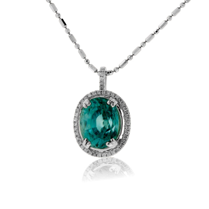 Oval Blue Zircon with Diamond Halo Pendant - Park City Jewelers