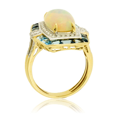 Oval Cabochon Opal Ring with Blue Topaz & Diamond Halo - Park City Jewelers