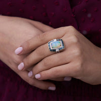 Oval Cabochon Opal Ring with Blue Topaz & Diamond Halo - Park City Jewelers