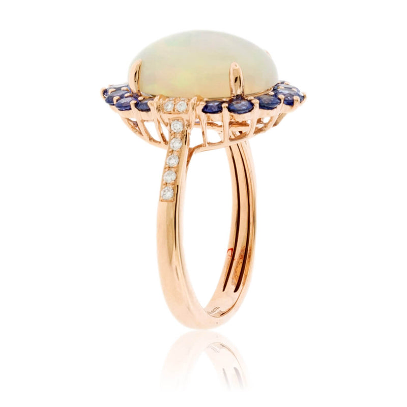 Oval Cabochon Opal Ring with Sapphire & Diamond Halo - Park City Jewelers