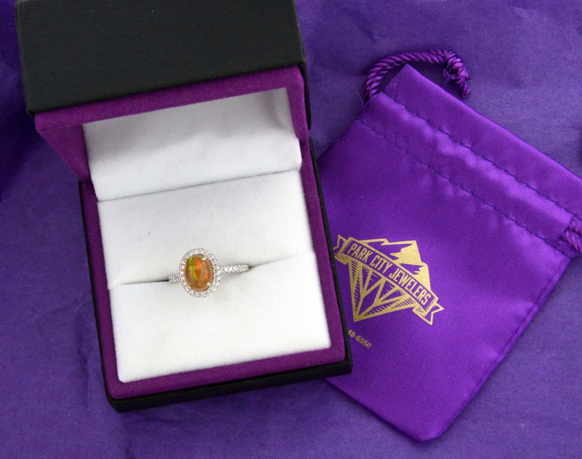 Oval Ethiopian Opal and Diamond Halo Ring - Park City Jewelers