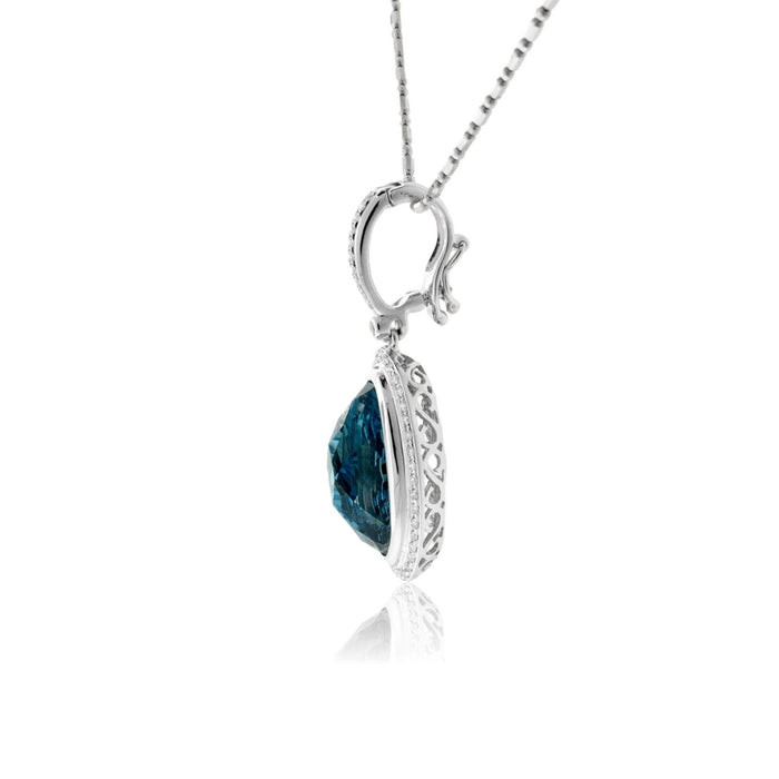Oval Fancy Cut Blue Topaz & Diamond Halo Pendant - Park City Jewelers